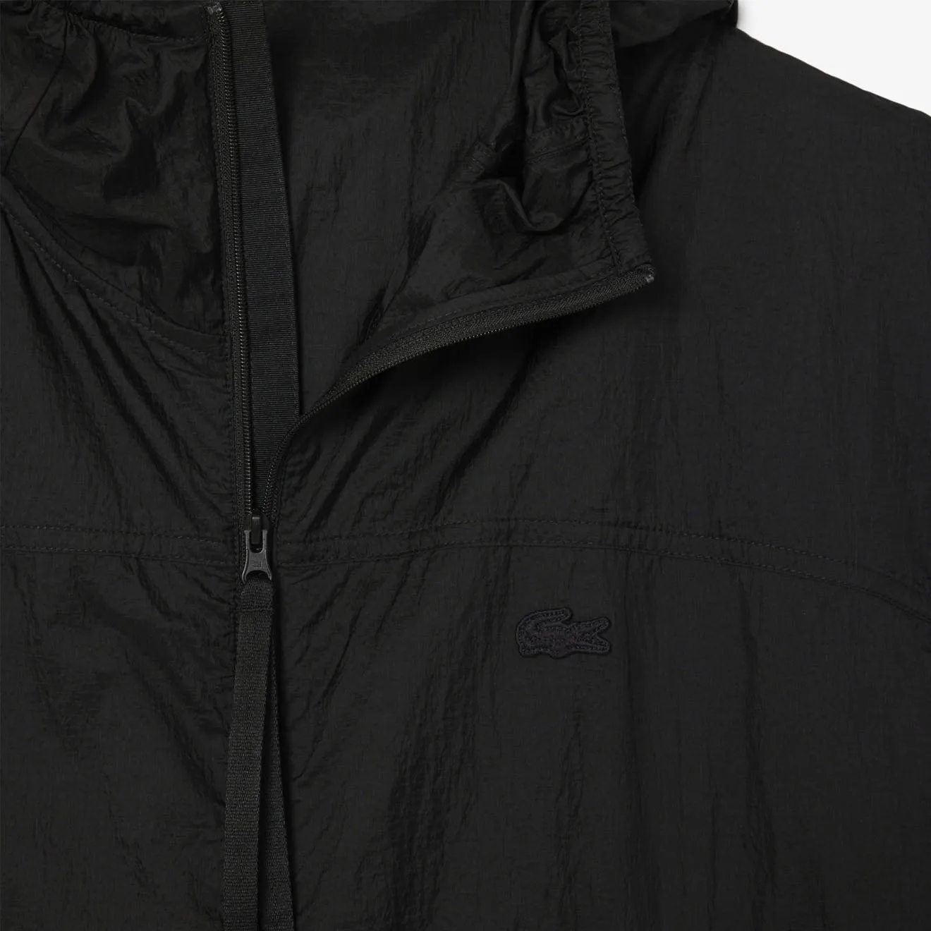 Lacoste wasserabweisende zusammenfaltbare Nylonjacke Schwarz